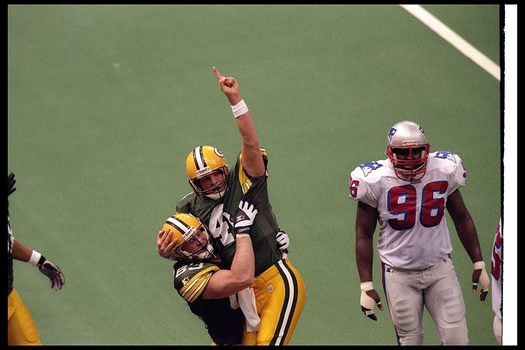 Quarterback Brett Favre of the Green Bay Packers celebrates with tight end Jeff Thomason during Super Bowl XXXI against the New England Patriots. 