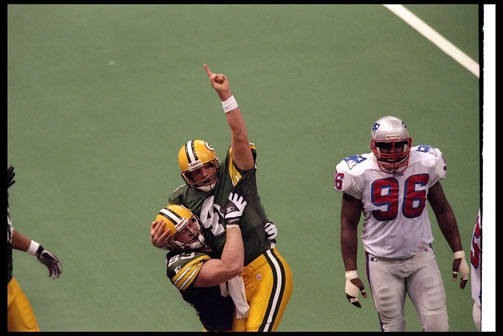 Quarterback Brett Favre of the Green Bay Packers celebrates with tight end Jeff Thomason during Super Bowl XXXI against the New England Patriots.