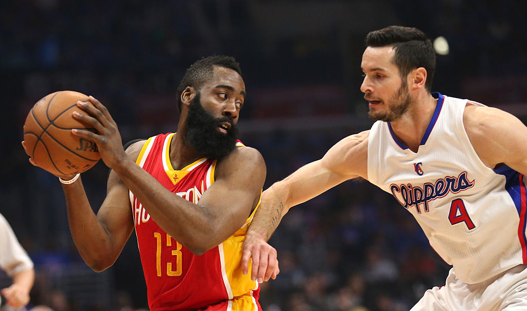 James Harden of the Houston Rockets controls the ball against J.J. Redick of the Los Angeles Clippers.