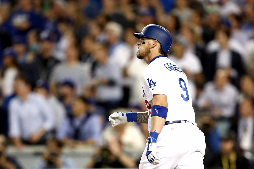 Yasmani Grandal of the Los Angeles Dodgers celebrates as he hits a two-run home run.
