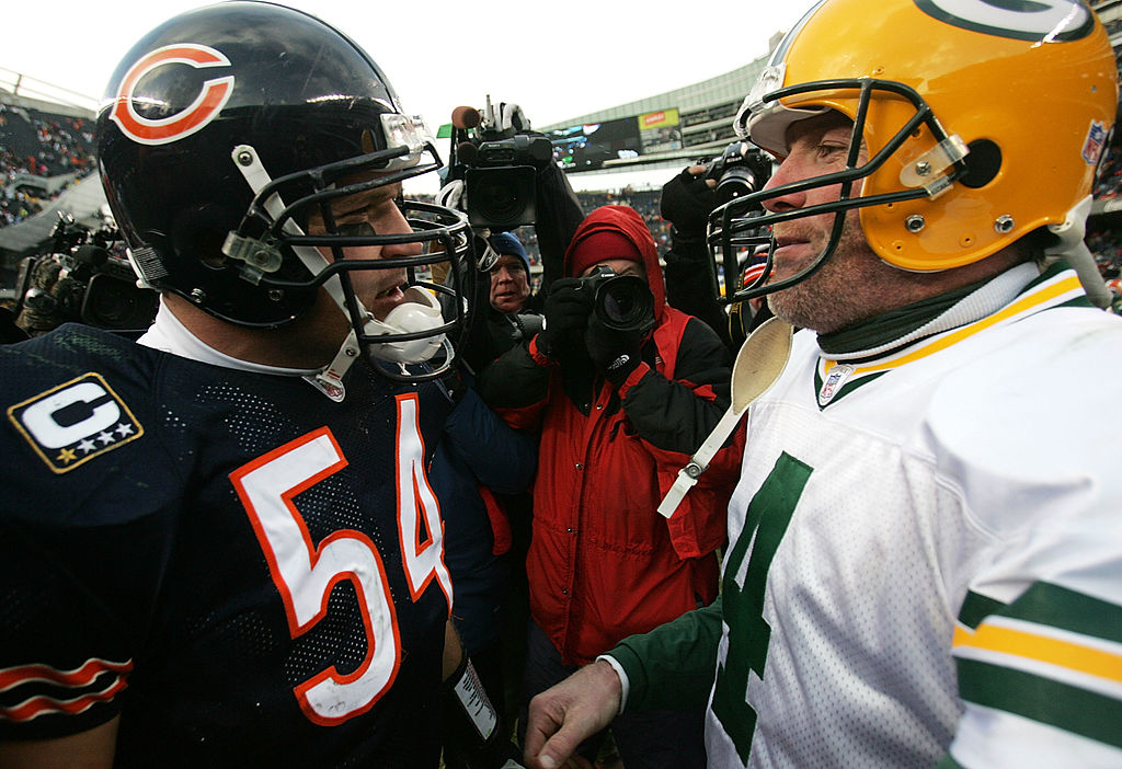 Brian Urlacher of the Chicago Bears talks with Brett Favre of the Green Bay Packers.