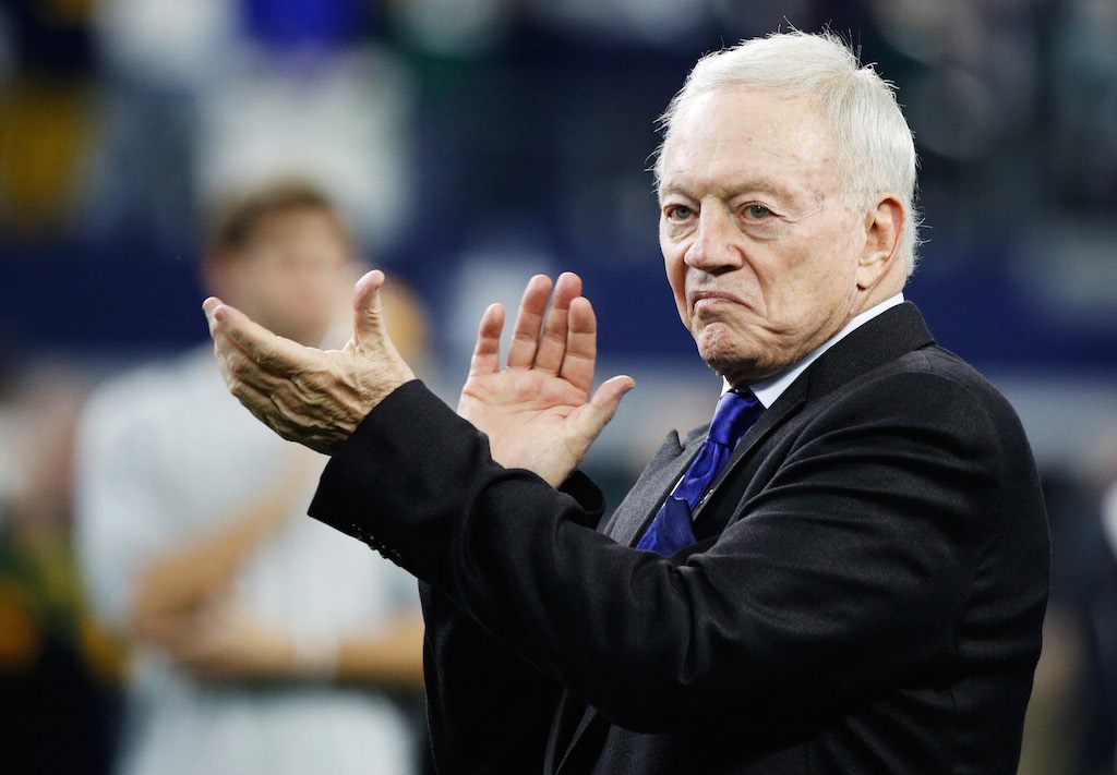 Dallas Cowboys owner Jerry Jones applauds during warmups.