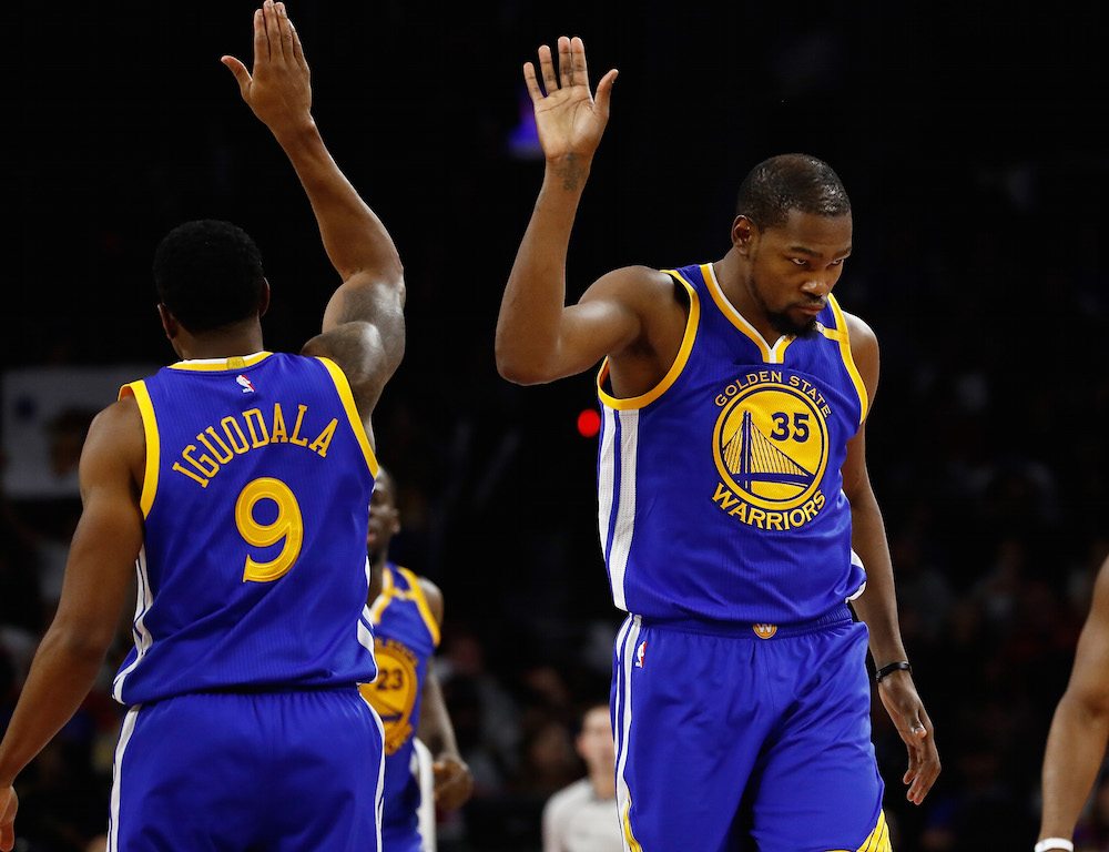 Kevin Durant of the Golden State Warriors celebrates a second half basket with Andre Iguodala.