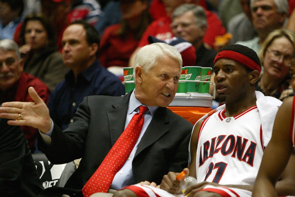 Head coach Lute Olson speaks with Hassan Adams of the Arizona Wildcats.