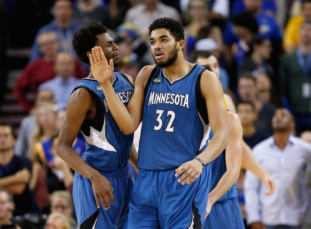 Karl-Anthony Towns #32 of the Minnesota Timberwolves is congratulated by Andrew Wiggins #22.