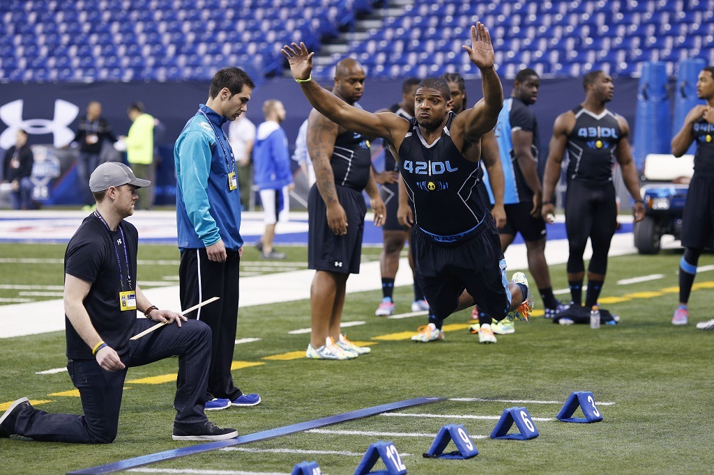 Former Missouri defensive lineman Michael Sam takes part in the broad jump during the 2014 NFL Combine.