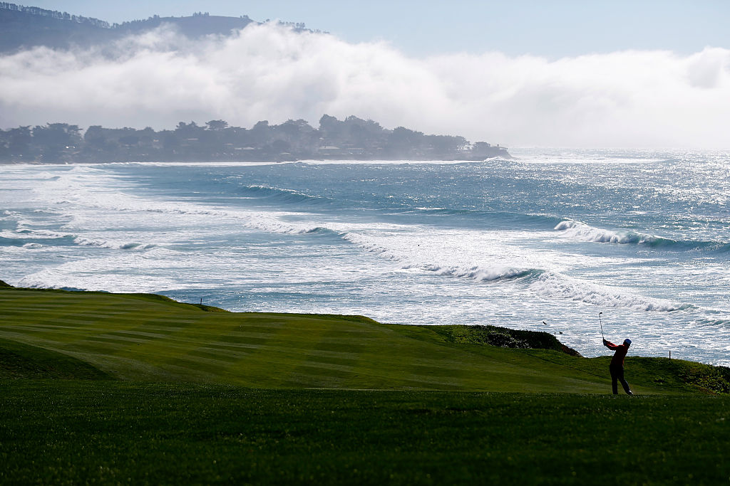 Sung Kang of Korea plays a shot from the fairway on the 10th hole during round three.
