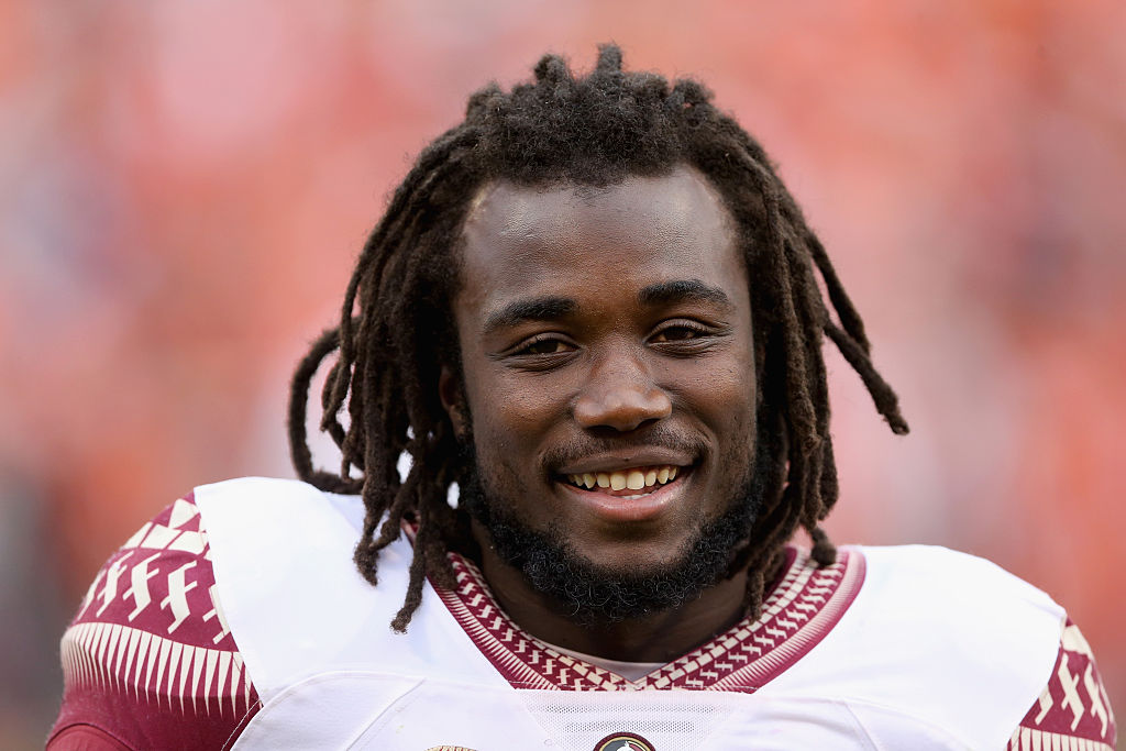 Dalvin Cook #4 of the Florida State Seminoles watches before a game.