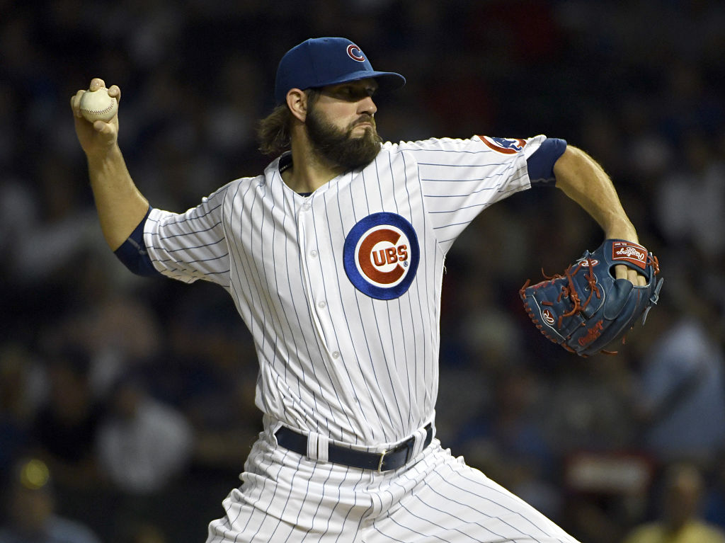 Jason Hammel of the Chicago Cubs throws against the Cincinnati Red.