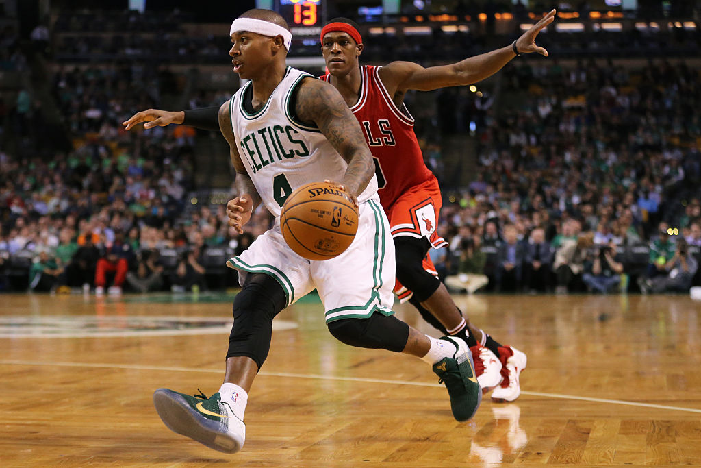 Isaiah Thomas of the Boston Celtics drives against Rajon Rondo of the Chicago Bulls.