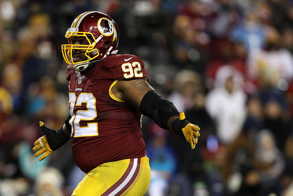 Defensive end Chris Baker of the Washington Redskins reacts after sacking quarterback Cam Newton