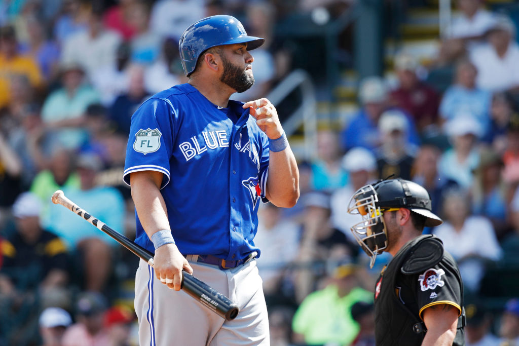 Kendrys Morales reacts after swinging and missing at a pitch.