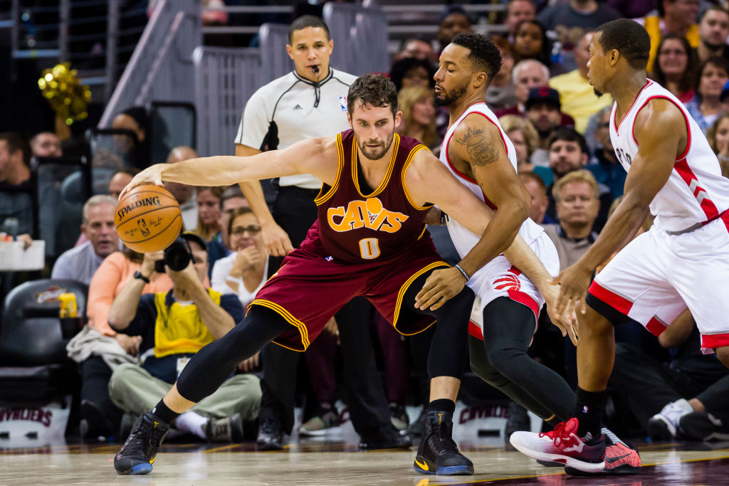 Kevin Love of the Cleveland Cavaliers posts up Norman Powell of the Toronto Raptors.