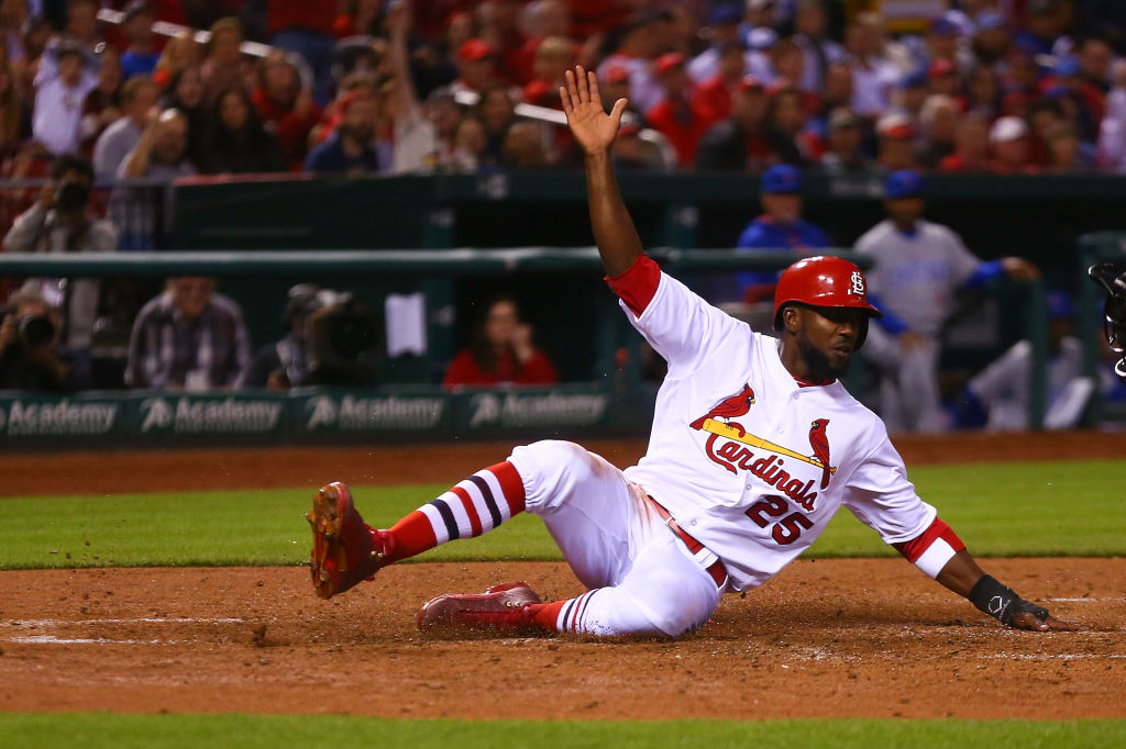 Dexter Fowler of the St. Louis Cardinals scores a run against the Chicago Cubs.