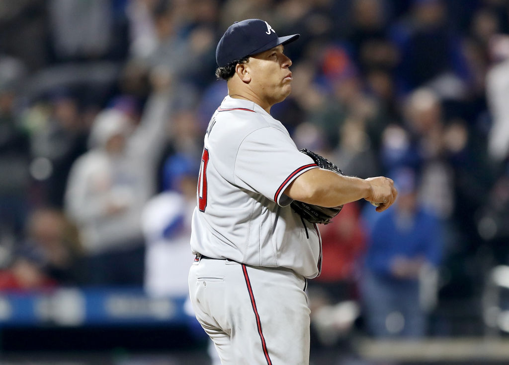 Bartolo Colon of the Atlanta Braves reacts after he gave up a solo home run.