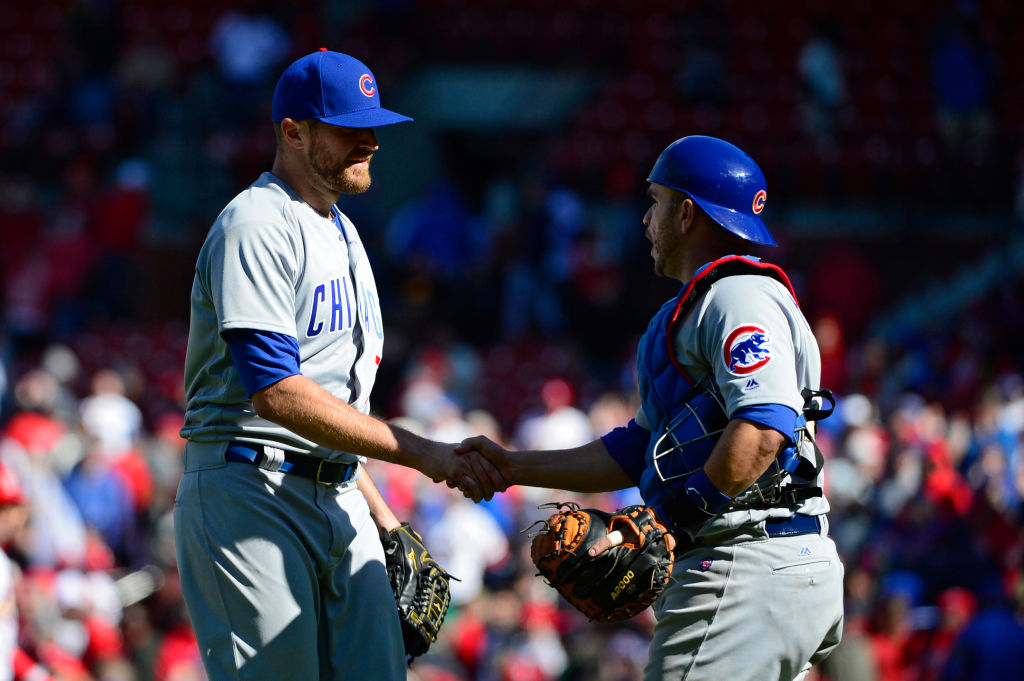 Wade Davis of the Chicago Cubs celebrates with Miguel Montero after closing out the ninth inning against the St. Louis Cardinals.