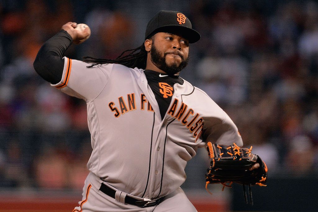 Johnny Cueto delivers the pitch.