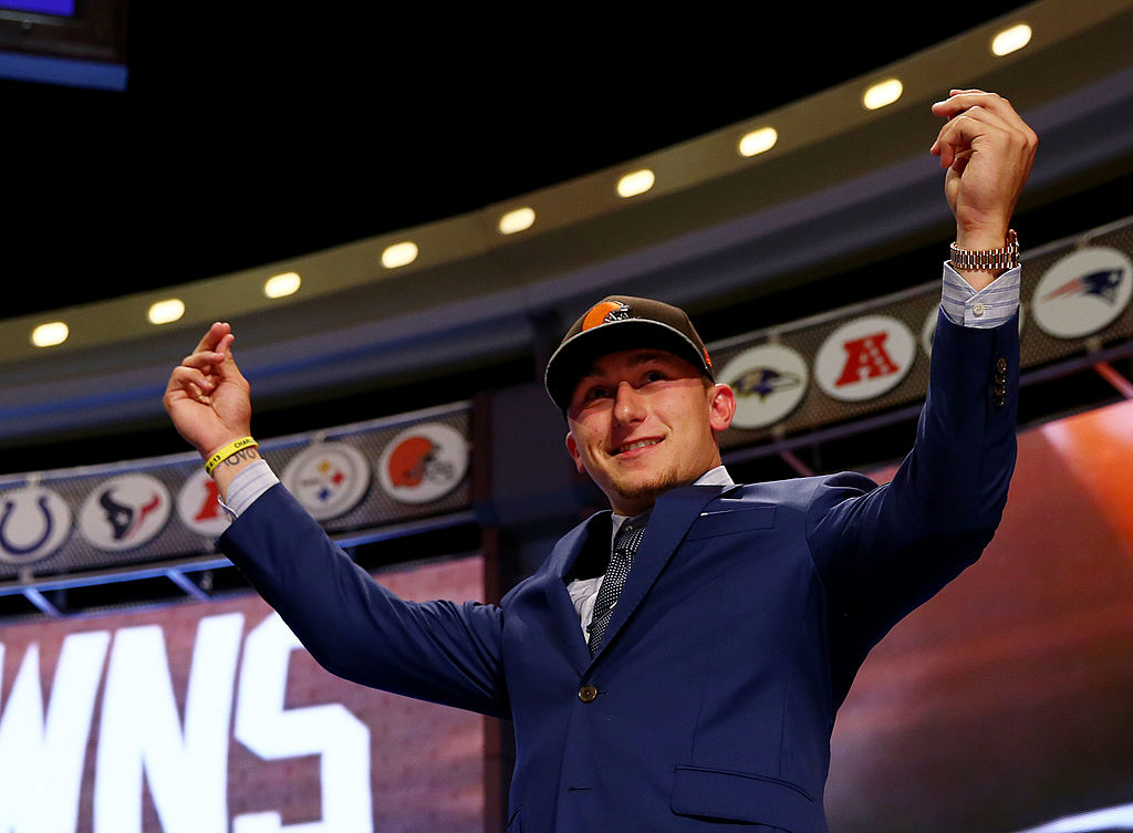 Johnny Manziel of the Texas A&M Aggies takes the stage after he was picked #22 overall by the Cleveland Browns during the first round of the 2014 NFL Draft at Radio City Music Hall on May 8, 2014 in New York City. (Photo by Elsa/Getty Images)