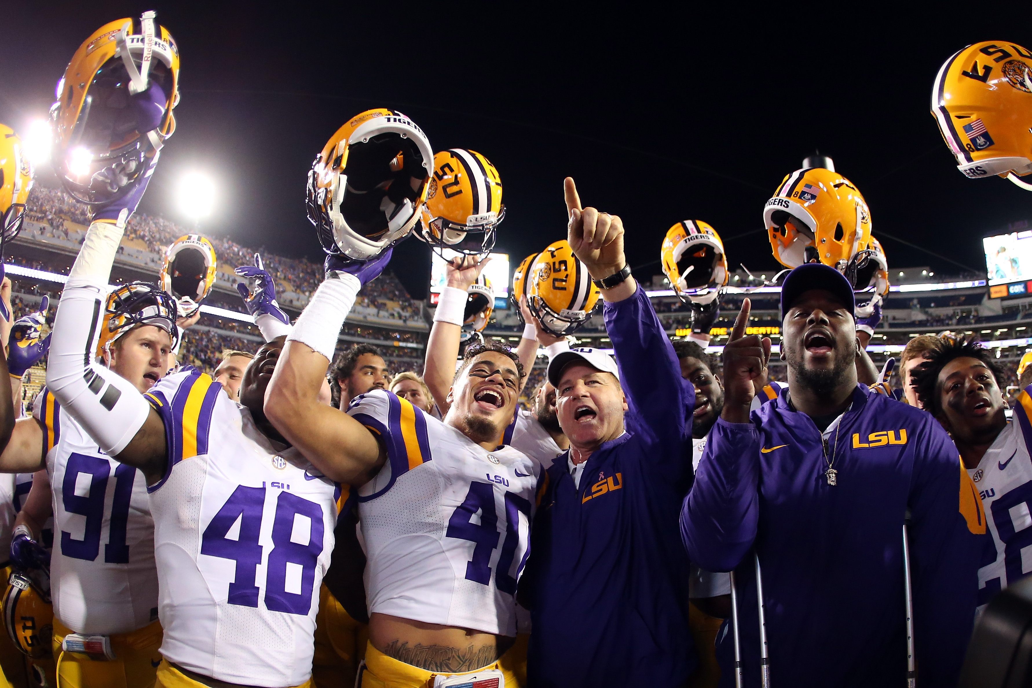 The LSU Tigers celebrate a victory in 2015.