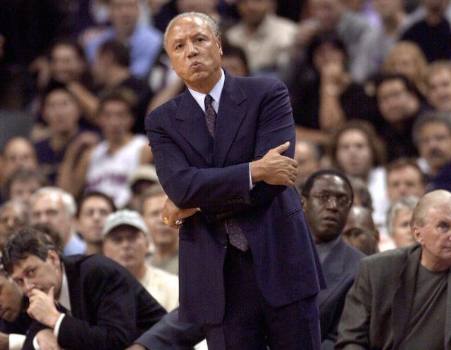 Lenny Wilkens looks on from the sidelines.