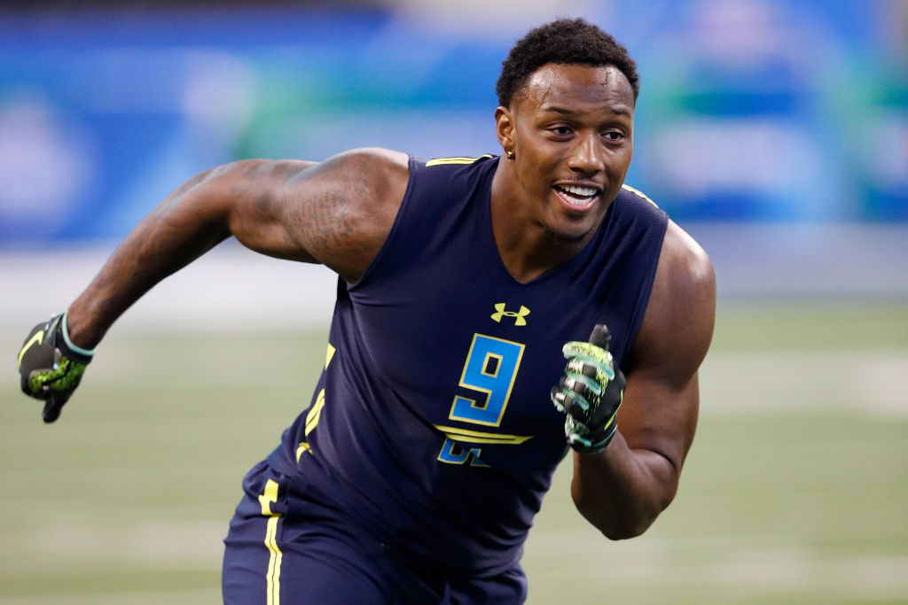 Defensive lineman Taco Charlton of Michigan participates in a drill during the NFL Combine.