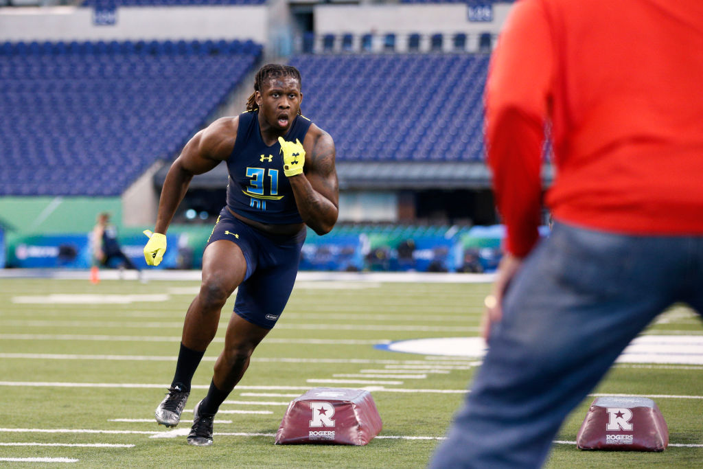 Defensive lineman Takkarist McKinley of UCLA participates in a drill during the NFL Combine.