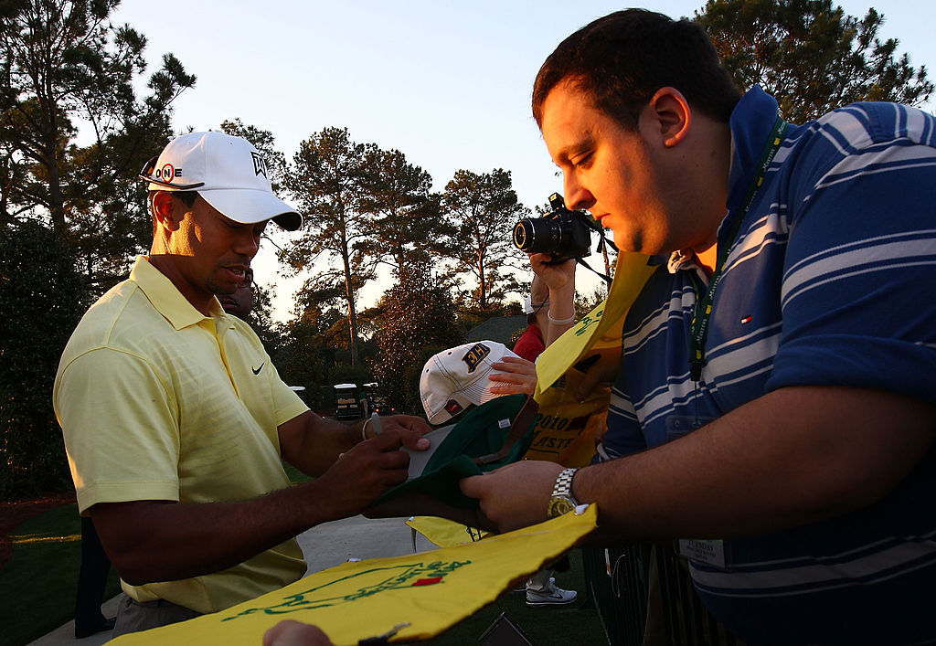 Tiger Woods signs autographs for fans prior to the 2010 Masters Tournament.