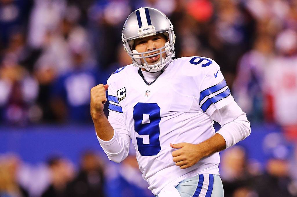 Tony Romo #9 of the Dallas Cowboys celebrates throwing the game-winning touchdown pass.