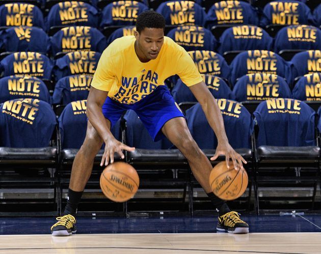 Damian Jones warms up before the game.