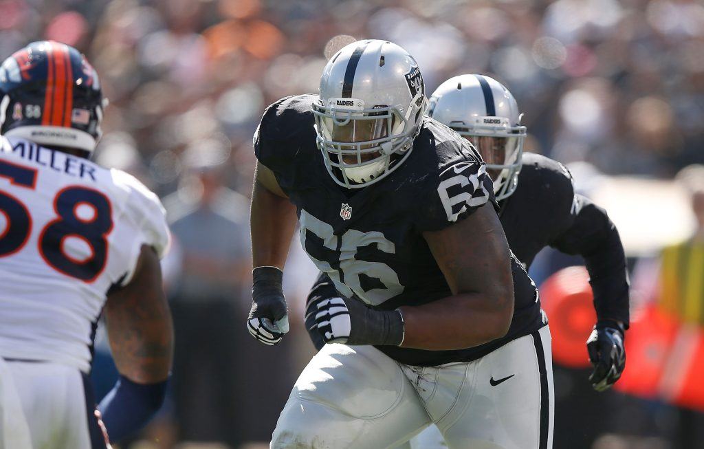 Gabe Jackson blocks for Latavius Murray in 2015.