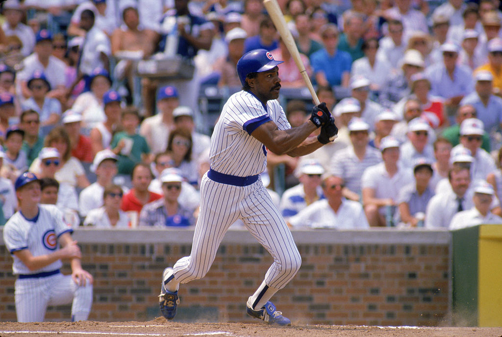 Andre Dawson swings and prepares to head to first base.
