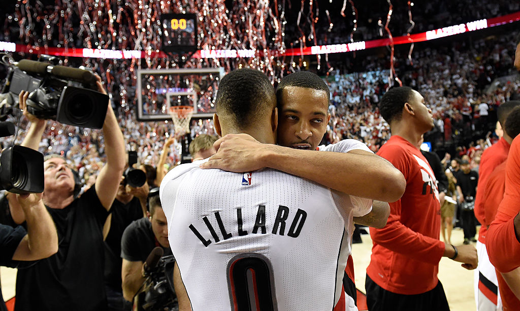 Damian Lillard and C.J. McCollum embrace after their Game 6 victory over the Los Angeles Clippers.