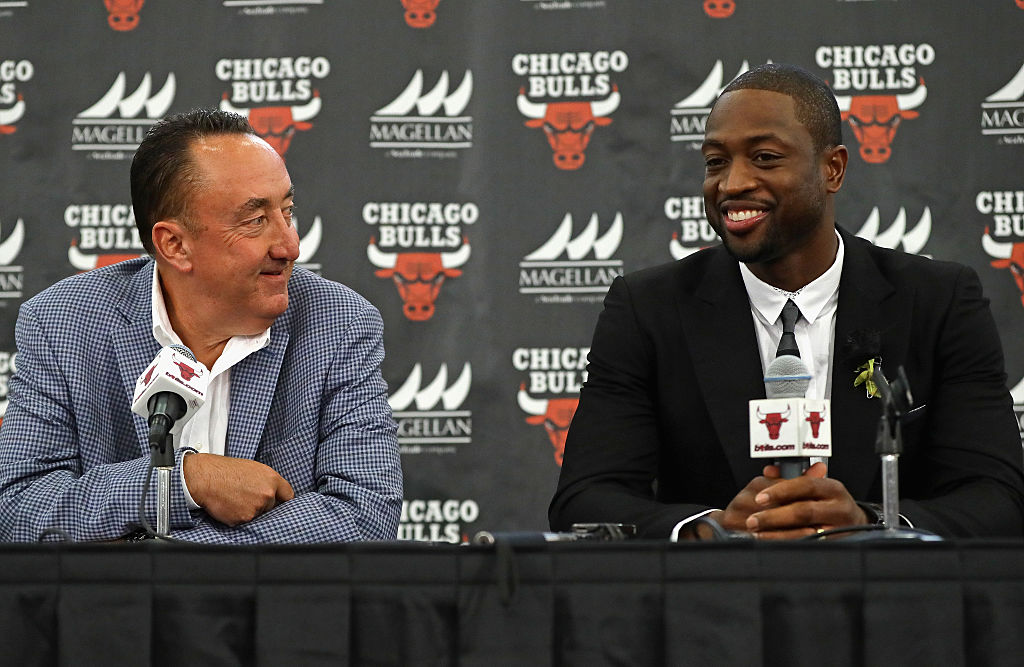 General manager Gar Forman of the Chicago Bulls presents new Bull Dwyane Wade an introductory press conference