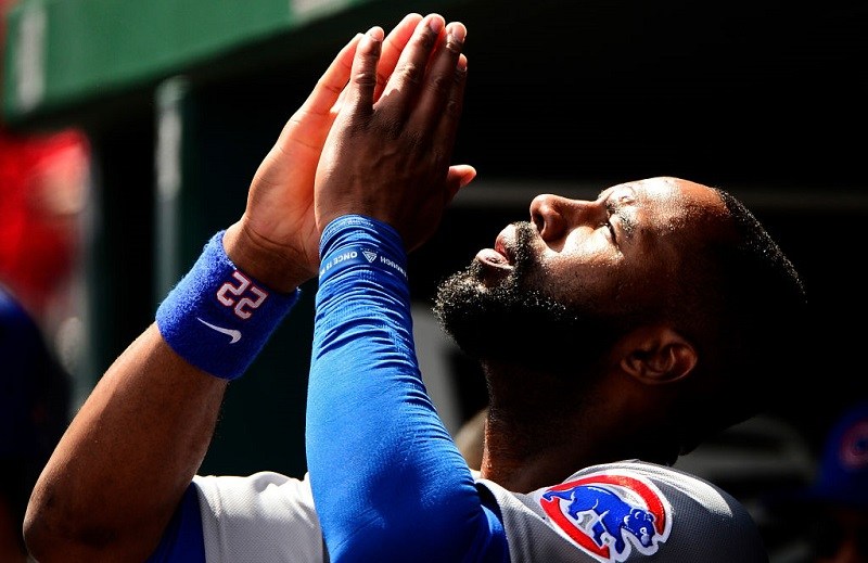 Cubs outfielder Jason Heyward offers a prayer.