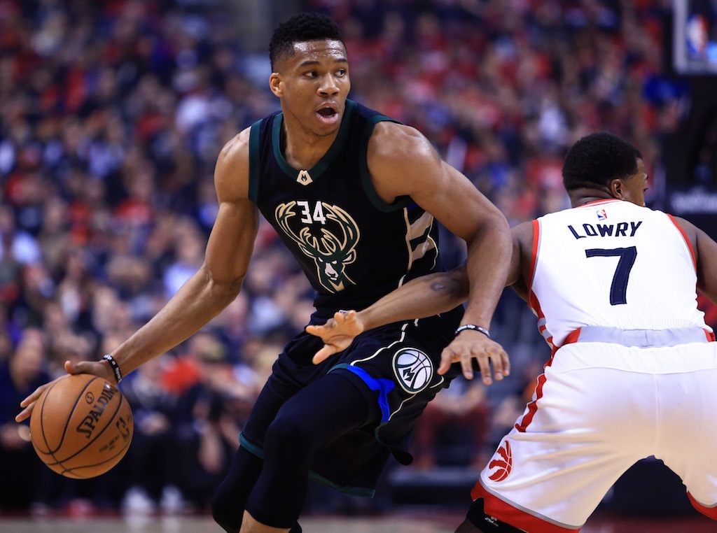 Giannis Antetokounmpo dribbles against the Raptors.