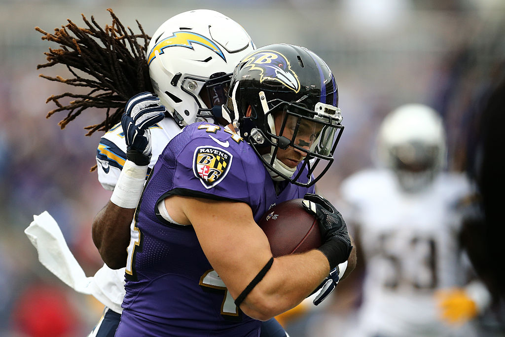 Fullback Kyle Juszczyk, now with the San Francisco 49ers, is tackled by strong safety Jahleel Addae of the San Diego Chargers. 