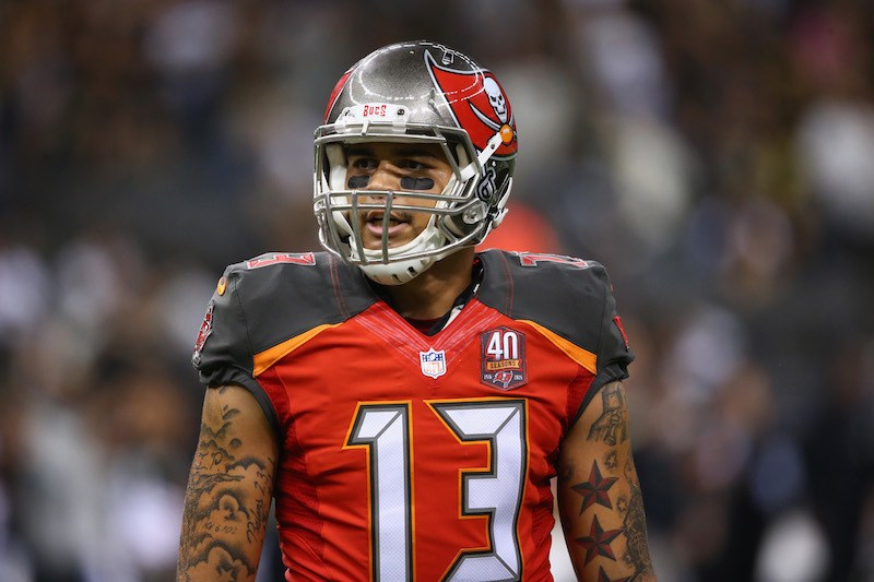 Mike Evans takes a break during a timeout.