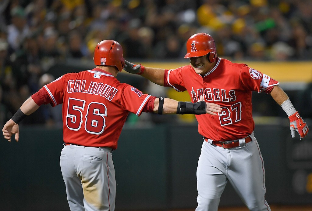 Kole Calhoun and Mike Trout celebrate a home run.
