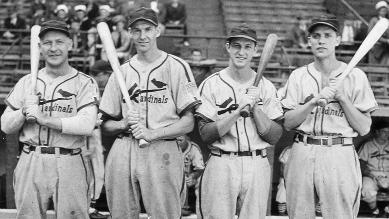 The St. Louis Cardinals infield poses for a portrait in Sportsmans Park in St. Louis before the start of game one of the 1944 World Series. They are Whitey Kurowski, Marty Marion, Stan Musial, and unknown.