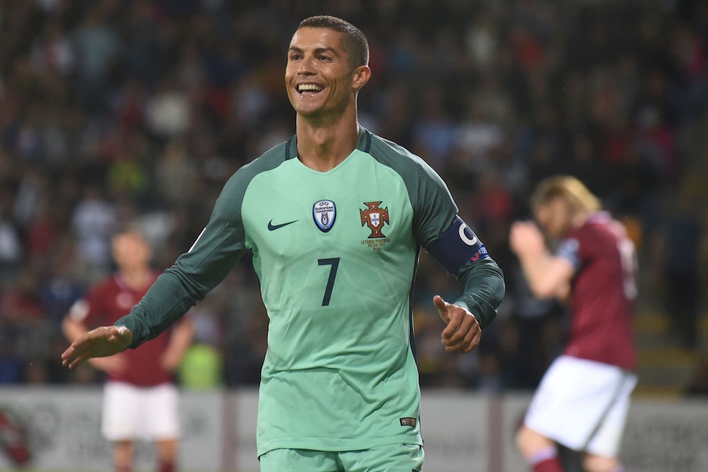 Cristiano Ronaldo scores a goal. Cristiano Ronaldo scores a goal.
