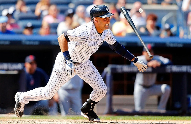 Derek Jeter of the New York Yankees follows through on an infield base hit.