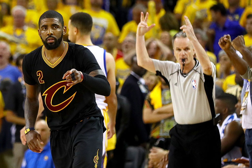 Kyrie Irving gets in the game during a substitution.