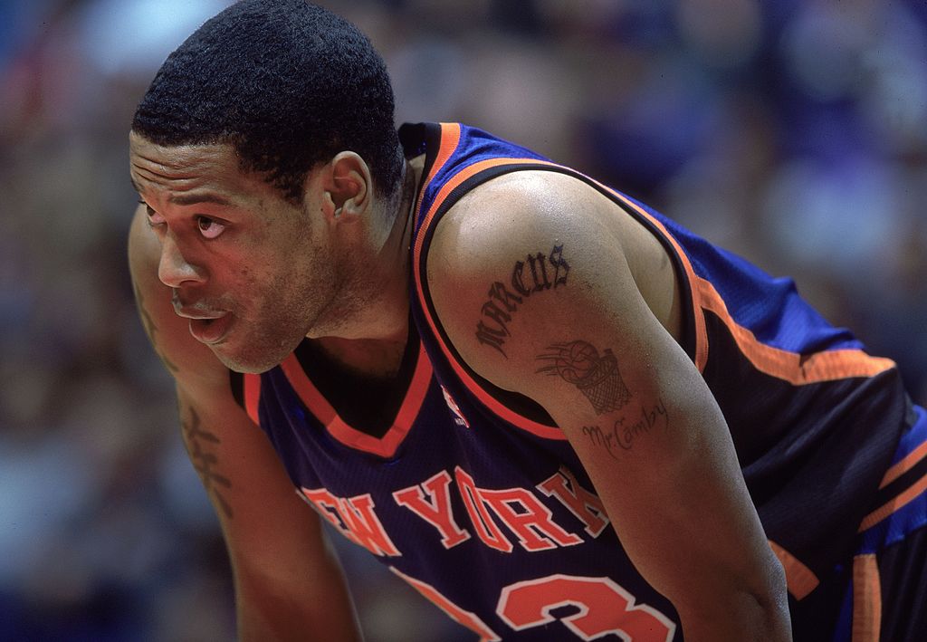 Marcus Camby rests between plays.