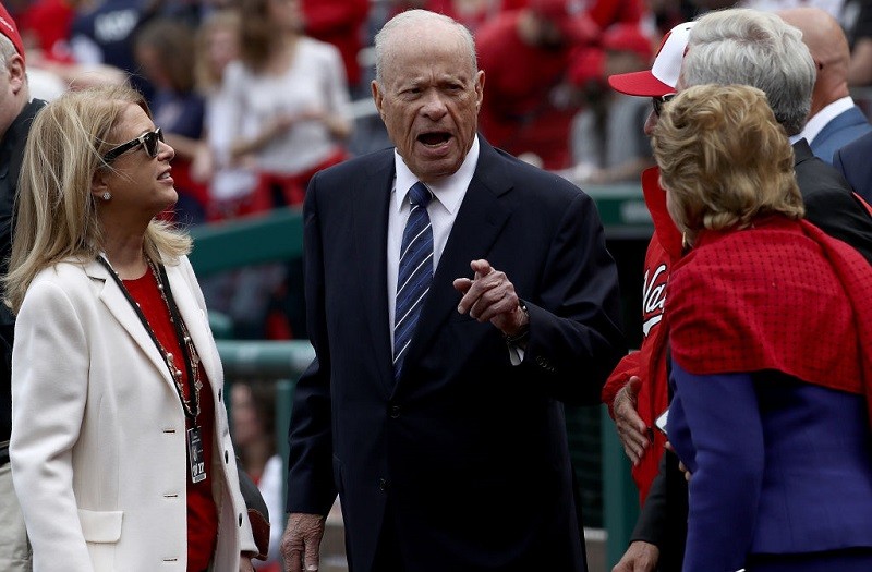 Nationals owner Ted Lerner and family talks between innings at Nationals Park.
