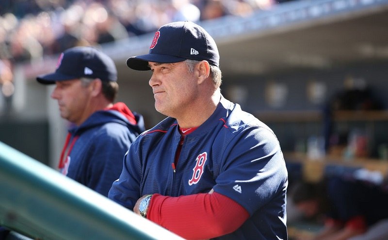 Boston Red Sox manager John Farrell watches the action.