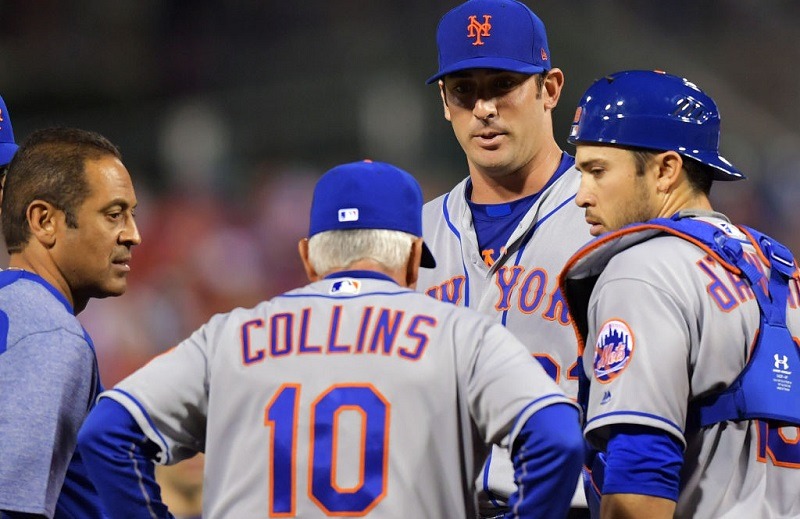 Matt Harvey of the New York Mets talks on the mound.