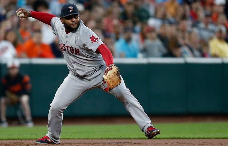 Pablo Sandoval of the Boston Red Sox misses fielding a ball.