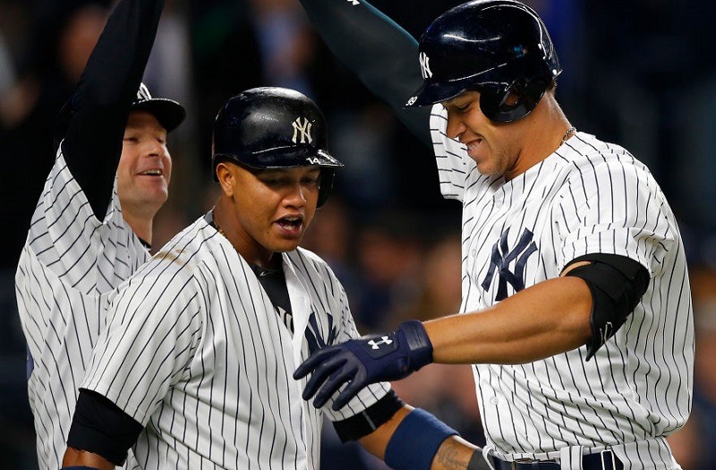 Closeup of Aaron Judge, Chase Headley, and Starlin Castro celebrating after Judge's home run on May 3, 2017