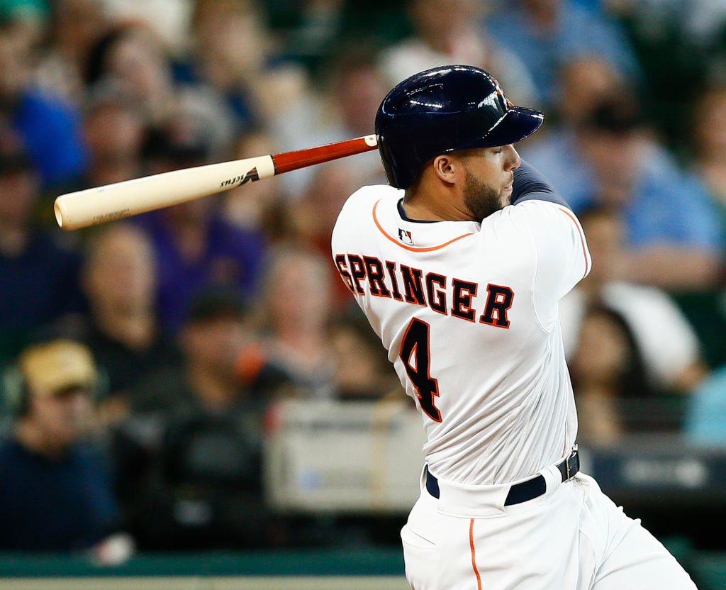 George Springer swings at a pitch