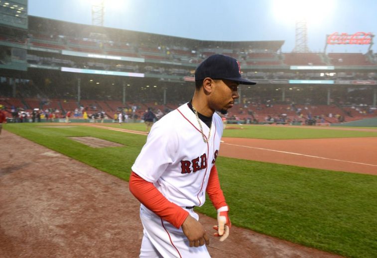Mookie Betts walks along the infield.